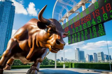 Bronze bull statue with stock ticker and São Paulo skyline in the background.